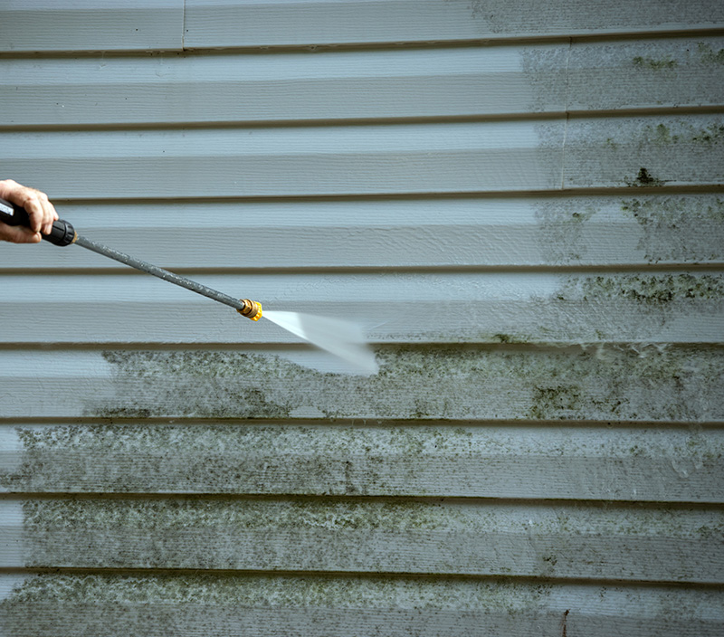 Pressure washing a house in Spokane, WA Pressure washing a house in Spokane, WA